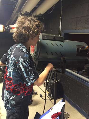 Student volunteers work as backstage assistants and techs